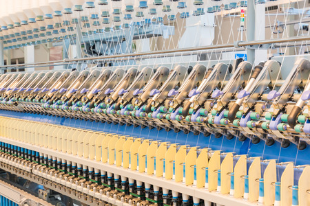 Machinery and equipment interior of textiles factory can be use for fabric industry background.の写真素材