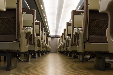 Interior of electric train with empty seats business transportation and travel background. business interior rail-car industrial.のeditorial素材