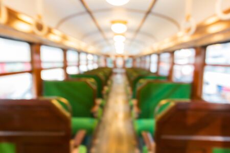 Abstract blurred Inside of train with empty seats business transportation interior blur background.