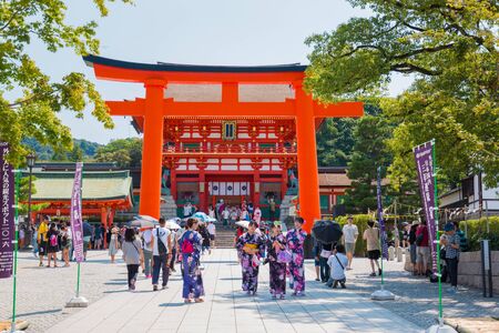 KYOTO, JAPAN - July 31, 2016: Tourists visiting Fushimi Inari shrine. Fushimi Inari Taisha is the head shrine of Inari, located in Fushimi-ku, Kyoto, Japan.のeditorial素材