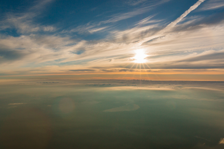 Beautiful sunrise seen from the top of the Mount Fuji, Japan. The morning light is called goraiko, "arrival of light".の写真素材