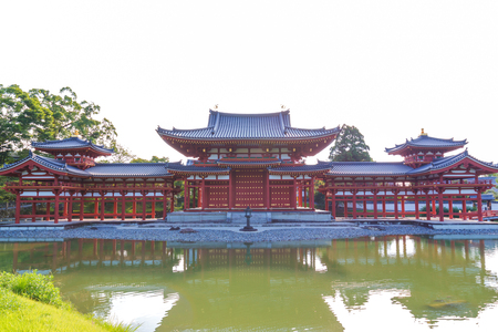 Byodo-in (Phoenix Hall) is a Buddhist temple in the city of Uji in Kyoto Prefecture, Japan. with white sky background.のeditorial素材