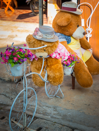 Teddy bears are cyclists took his friend on vacation at walking street.の写真素材