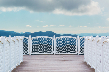 White balcony with perspective wood floor on nature background.の写真素材
