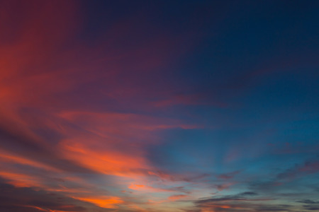 Sunset sky with clouds and bright sky blue background.の写真素材