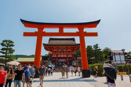 KYOTO, JAPAN - July 31, 2016: Tourists visiting Fushimi Inari shrine. Fushimi Inari Taisha is the head shrine of Inari, located in Fushimi-ku, Kyoto, Japan.のeditorial素材
