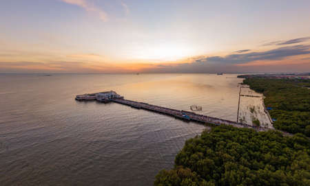 Landscape view  in sunset with seagulls and general cargo ship on background