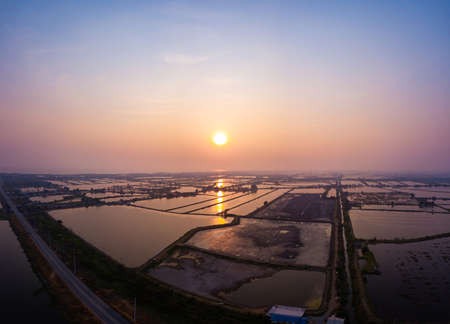 Sunset over field with beautiful aerial view landscape in Thailand.の写真素材