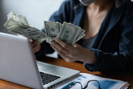 Hacker asia women stealing data success from online computer systems by using laptop. concept of business malware and hackerの写真素材