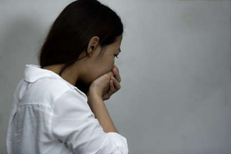 Asian girl using drug addict and hopeless concept, feeling be absent-minded, Lonely girl conceptの写真素材