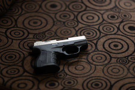 Blank gun without bullet on vintage background.の写真素材