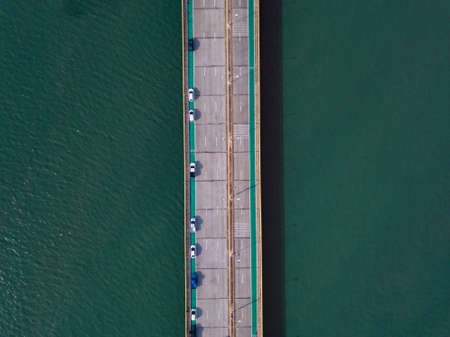 Aerial top view drone shot of new bridge chonburi with cars on bridge road image transportation background concept.の写真素材