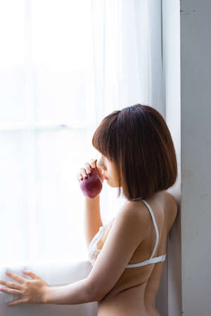 Portrait asian young woman wearing sexy bikini in bedroom. Sexy girl concept.の写真素材