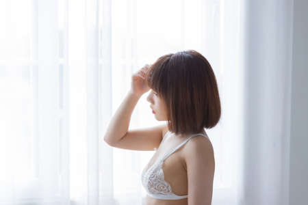 Portrait asian young woman wearing sexy bikini in bedroom. Sexy girl concept.の写真素材