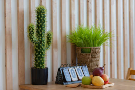 Fruits and wooden calendar on wooden table indoors, close up.の写真素材