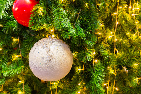 Close up Christmas decoration on the Christmas tree. Christmas ball on texture background.の写真素材