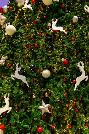 Close up Christmas decoration on the Christmas tree. Christmas ball on texture background.の写真素材