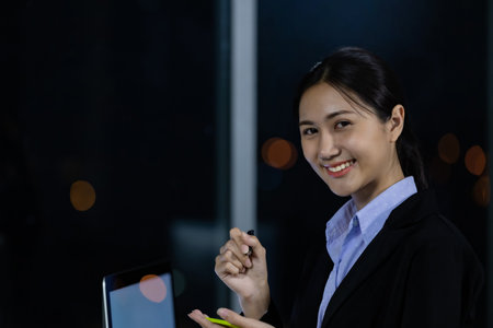 Portrait young business woman at office and write sticky notes to share ideas. Idea modern creative business communication brainstorming conceptの写真素材