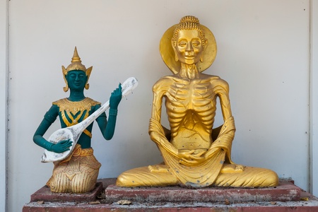 Lord Buddha doing self mortification and the god playing music to relief his stressの写真素材