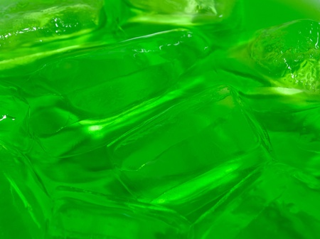 Green Soda with Melted Ice Backgroundの写真素材