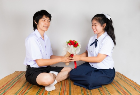 Boyfriend gives flower to girlfriendの写真素材