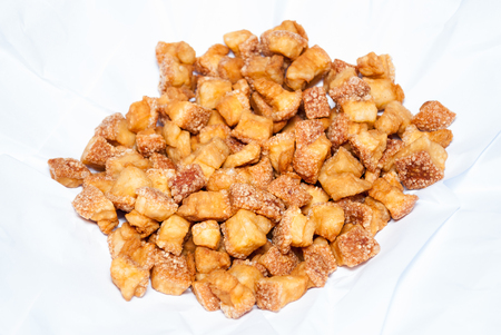 Deep Fried Pork Skin on White Paper [Soft Focus].の写真素材