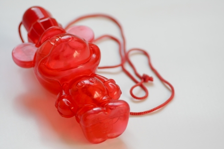 Red bear blow child toy の写真素材