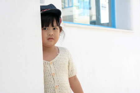 girl behind the wallの写真素材