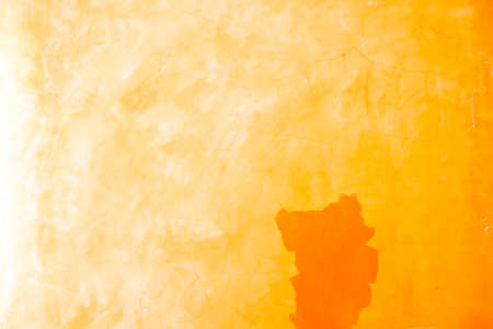 Yellow concrete wall background textureの写真素材