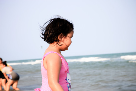 happy holiday life style lovely girl playing on the beachの写真素材