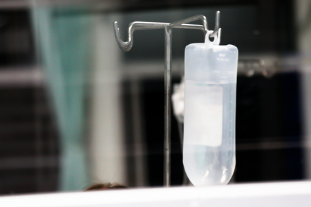 Composition with pills, tablet, bottle of saline and syringeの写真素材