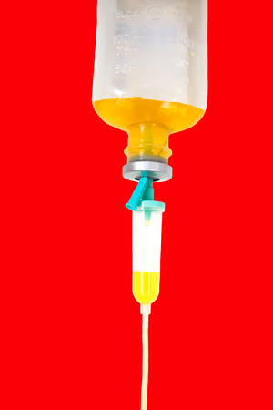 Close up saline solution drip for patient and infusion pump in hospitalの写真素材
