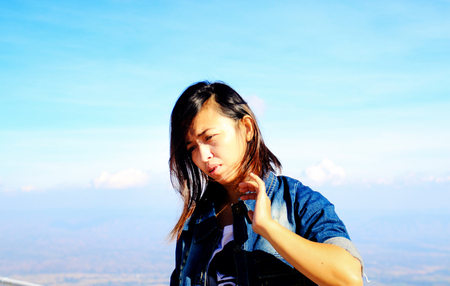 Happy woman relaxing outdoors travel actionの写真素材