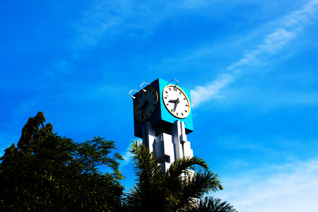 Tower clock on the blue sky