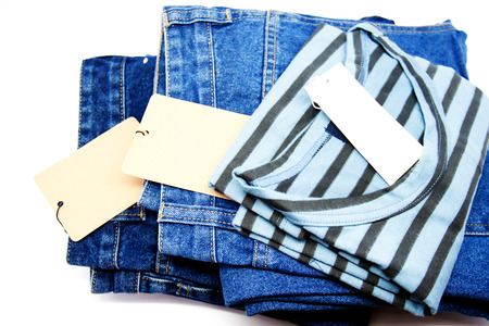 New stripes mens shirt. T-shirt and blue jeans background