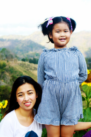 happy young family spending time outdoor on a summer dayの写真素材