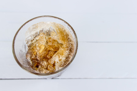 Ice glass with sparkling water on the white wood table refreshing conceptの写真素材