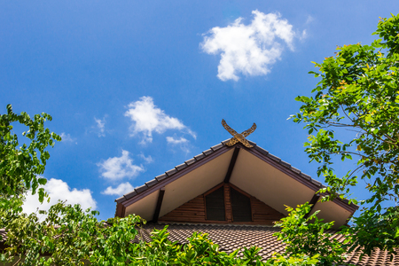 Roof,blue Sky and green tree the art Thailand style background