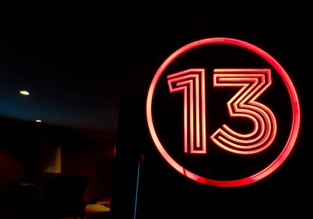 Lucky Number 13 On the red light sign Top of the cinema doorの写真素材