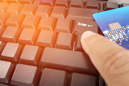 Hand a man press the key on the computer keyboard for working concept  and payment for credit card