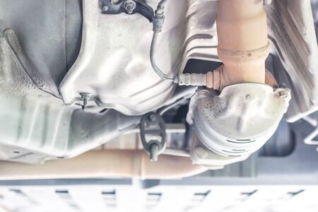 Close up oxygen sensor on Catalyst pipe of gasoline engine car on the hoist lift for service and repair in Garage shopの写真素材
