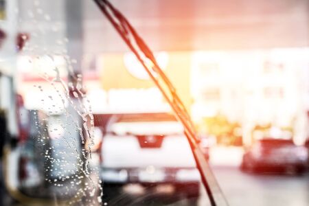 Bubble on the glass The windshield wipers  of car wash and cleaning in gas station の写真素材