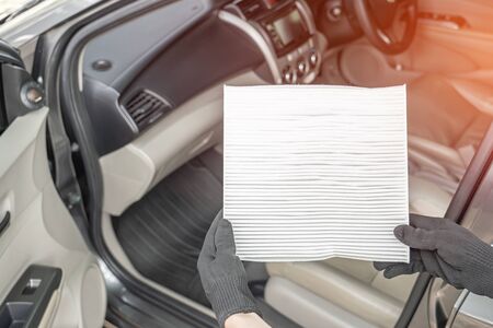 Women driver remove air filter in cooling system by myself check dust and amiss in Cabin of car service concept の写真素材