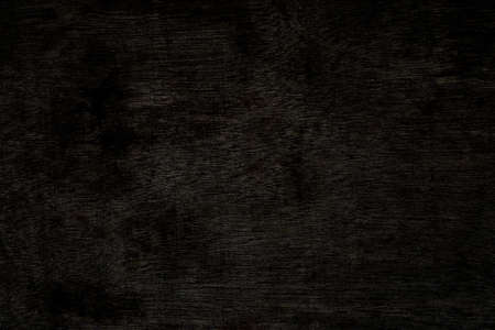 Old brown plywood with crack and burrs on the surface for background and textureの写真素材