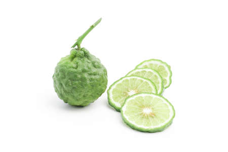 Bergamot and Kaffir lime slices with natural wrinkles on white backgroundの写真素材