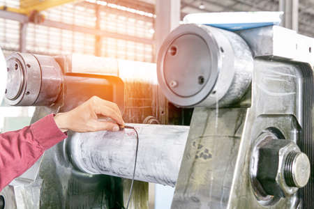 Inspector make ultrasonic test on surface steel work in factory for check crack in iron materialの写真素材