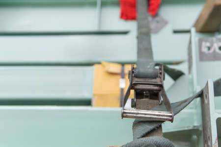 Close up Belt Ratchet Strap for fastening products to prevent falling on the truck with transportation work with site workの写真素材