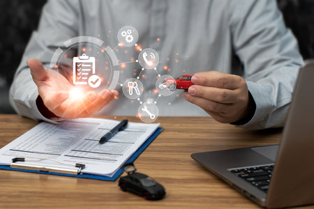Checklist icon and show screen in hand a man and toy car model, Business and car insurance concept protection from an accident and use the laptop on the table of the insurance veriの写真素材