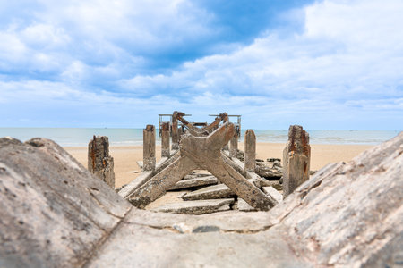 Close up Old port for fishing boats, old cement structure broken on the beach and sea rain cloud sky in background,Landmark  Pranburi,Prachuap Khiri Khan Thailandの写真素材