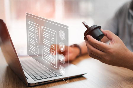 Businessman and car service on virtual screens checklist concept, Man check auto part about quality and product warranty with the laptop in the office, Oil gear filter car of serviの写真素材